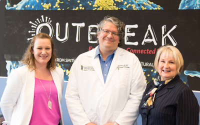 (l-r) Tara Wink, MLS, HS/HLS librarian and archivist, Justin Ortiz, MD, MS, associate professor, UMSOM, and M.J. Tooey, MLS, Vice President of Academic Affairs, HS/HLS at the opening reception for the 