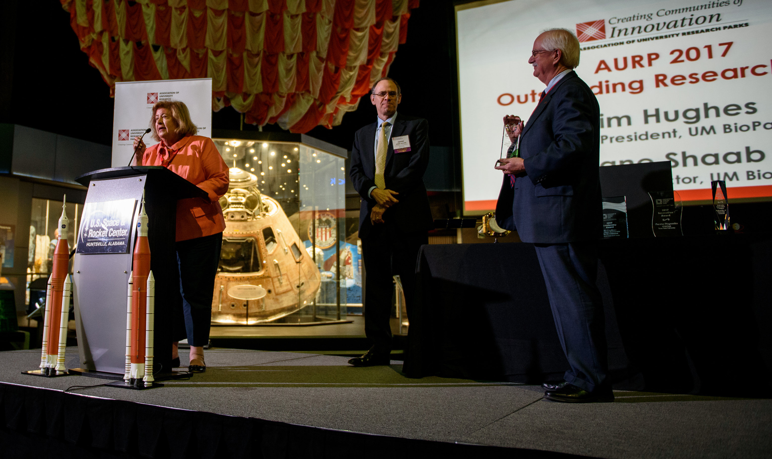 Jane Shaab, executive director of the BioPark, prepares to accept the award for Outstanding Research Park.