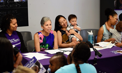 From left, B'more for Healthy Babies Resource Mom Shasha Satchell, Bronwyn Mayden, MSW, executive director of Promise Heights and assistant dean at the University of Maryland School of Social Work, Baltimore City Health Commissioner Leana Wen, MD, with son Eli, and Zakiyya Seitu with son Xavier.