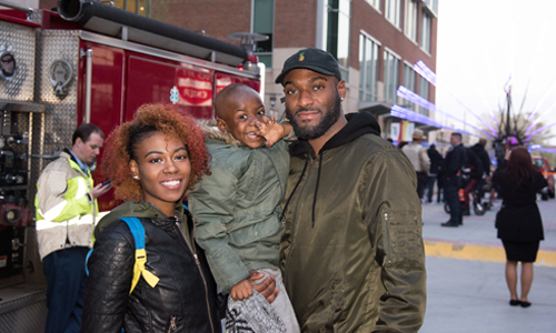 Ivan Wright, 4, and his parents Dejuana Roberts and Devonte Wright enjoyed the Light City celebration at UMB. 