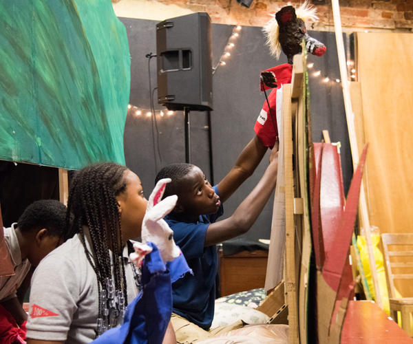 The PAL kids practice with their puppets in their final rehearsal at the Black Cherry Puppet Theater.