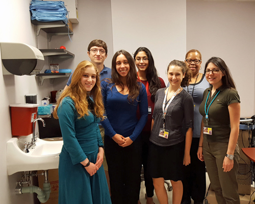 UM Scholar Shira Movsas and Luana Colloca, MD, PhD, (first row, third and fourth from left, respectively) pose for a picture with others who work in Colloca's lab.