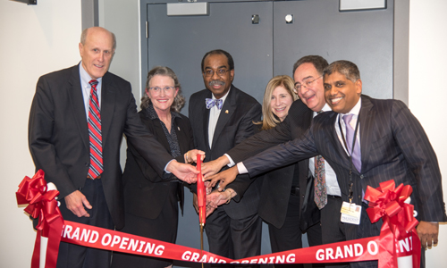 Bruce Jarrell, MD, FACS; Jane M. Kirschling, PhD, RN, FAAN; E. Albert Reece, MD, PhD, MBA; Lisa Rowen, DNSc, RN, CENP, FAAN; Jay A. Perman, MD; and Mohan Suntha, MD, MBA, cut the ribbon for the new Standardized Patient Program facility housed in the School of Nursing.