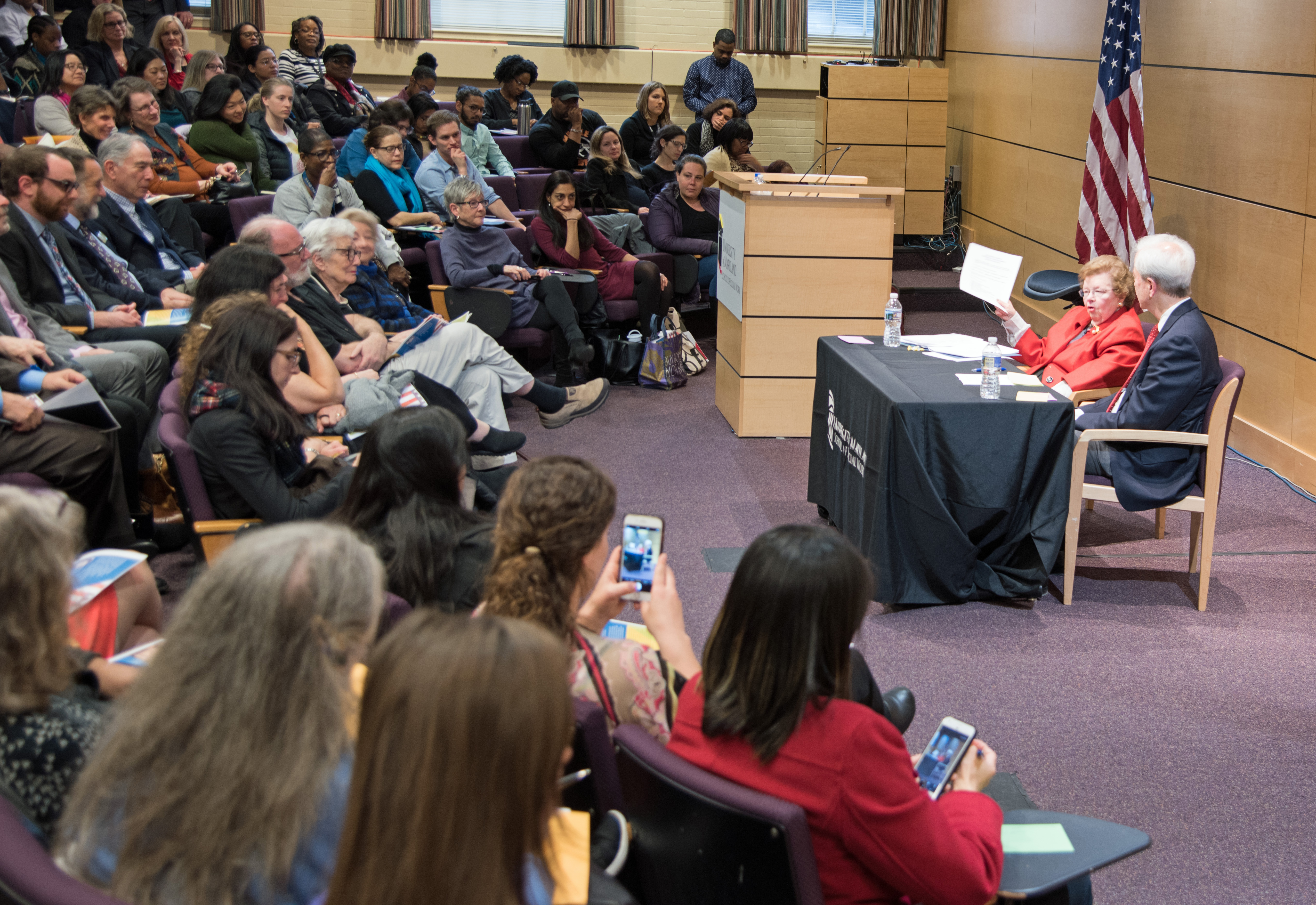 Retired Sen. Barbara Mikulski holds up guidelines on organizing on community organizing, advocacy, and public policy, which she developed more than 50 years ago as a student at the University of Maryland School of Social Work, a document she uses still to this day.