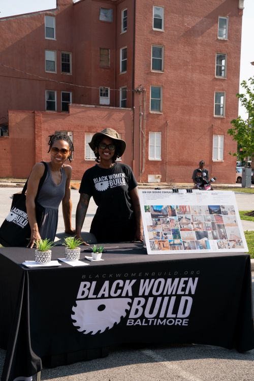 Representatives from Black Women Build Baltimore share resources and connect with community members.