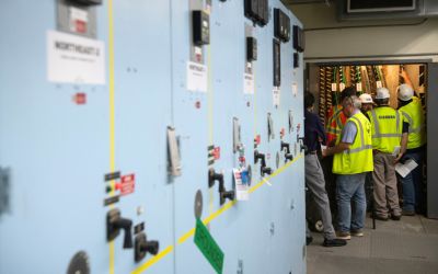 Contractors and the UMB Operations and Maintenance team in the S. Greene Street switching station.