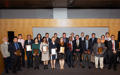 Leaders with some of the 48 researchers who received plaques for technology patents — UMB’s best year ever.