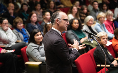 Maryland Carey Law Dean Donald Tobin, JD, asks Monica Lewinsky a question during the Q&A session. 