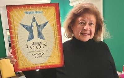 Jane M. Shaab, MBA, poses with her Maryland Daily Record 2020 Icon Honors Award. 