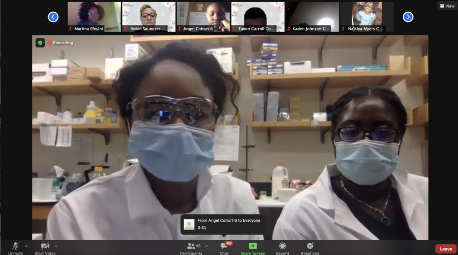 Ebehiremen Ayewoh and Brianna Scotland, both PhD students in the University of Maryland School of Pharmacy’s Department of Pharmaceutical Sciences, show the scholars how to make ice cream sundaes using liquid nitrogen.