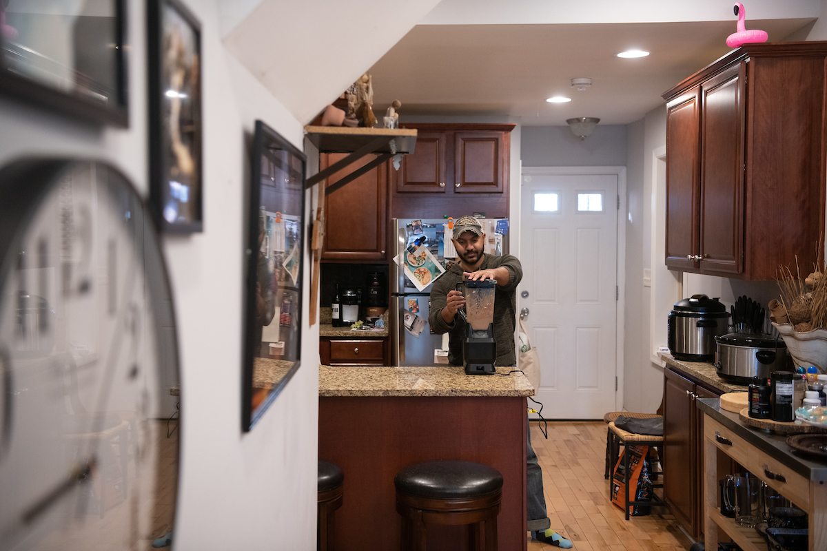LNYW participant Justin Hanna prepares a smoothie in his renovated kitchen. 