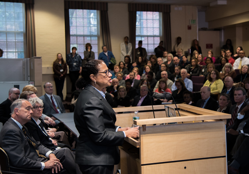 Middle States evaluation team chair Denise V. Rodgers addresses UMB faculty, staff, and students in the School of Social Work auditorium.