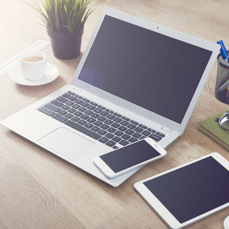 laptop and ipad on a desk