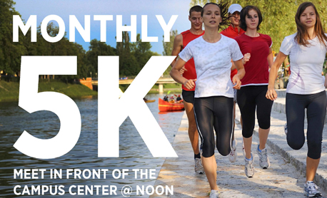 Student and staff running in a 5K near the water