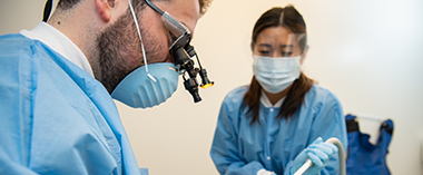 A dentist working on a patient