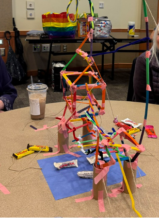 Photo of a bridge made with sticks, string and tape