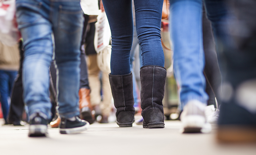 College students walking the city street.