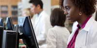 Image of a pharmacy students working at computers