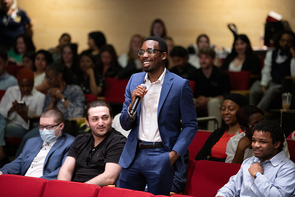 UMB Student asking question to a panel at the IPE Day 2026