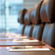 boardroom chairs lined up at a table