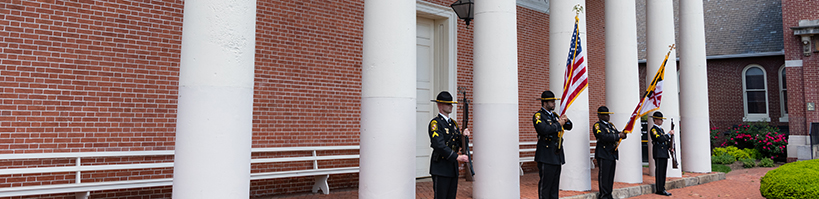 UMBPD Honor Guard standing in front of Davidge Hall