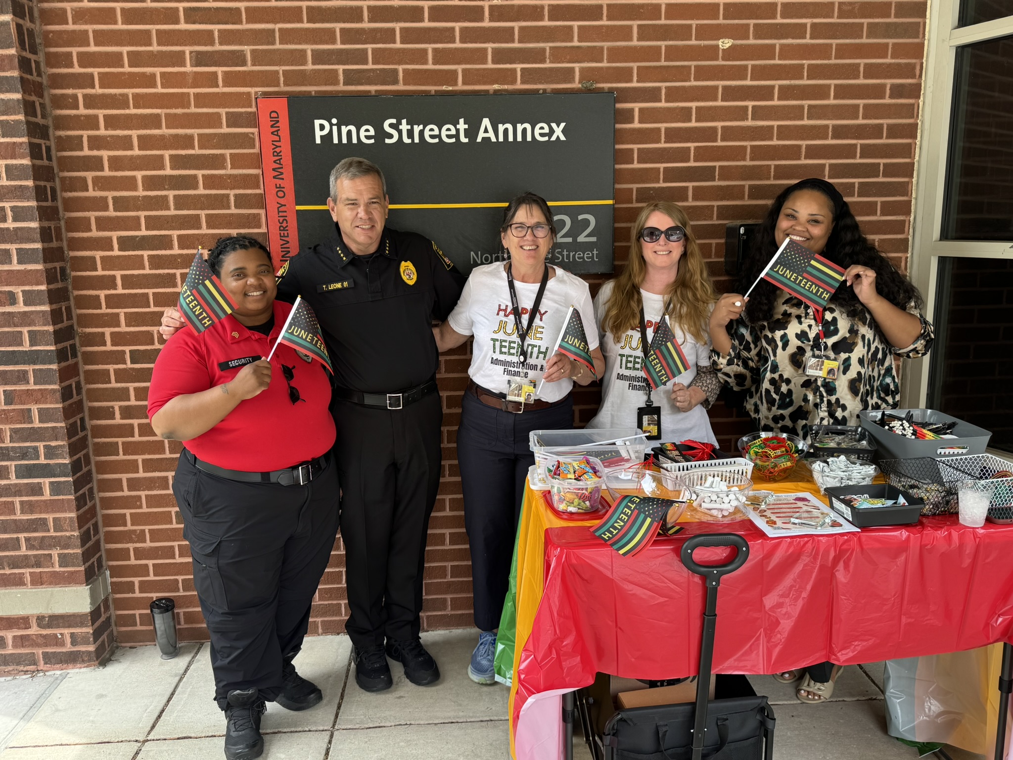 Police officers and staff at an informational table