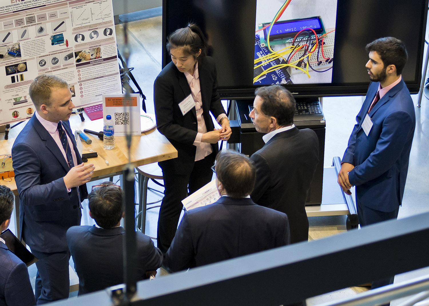 a group of professionals gather to discuss a project