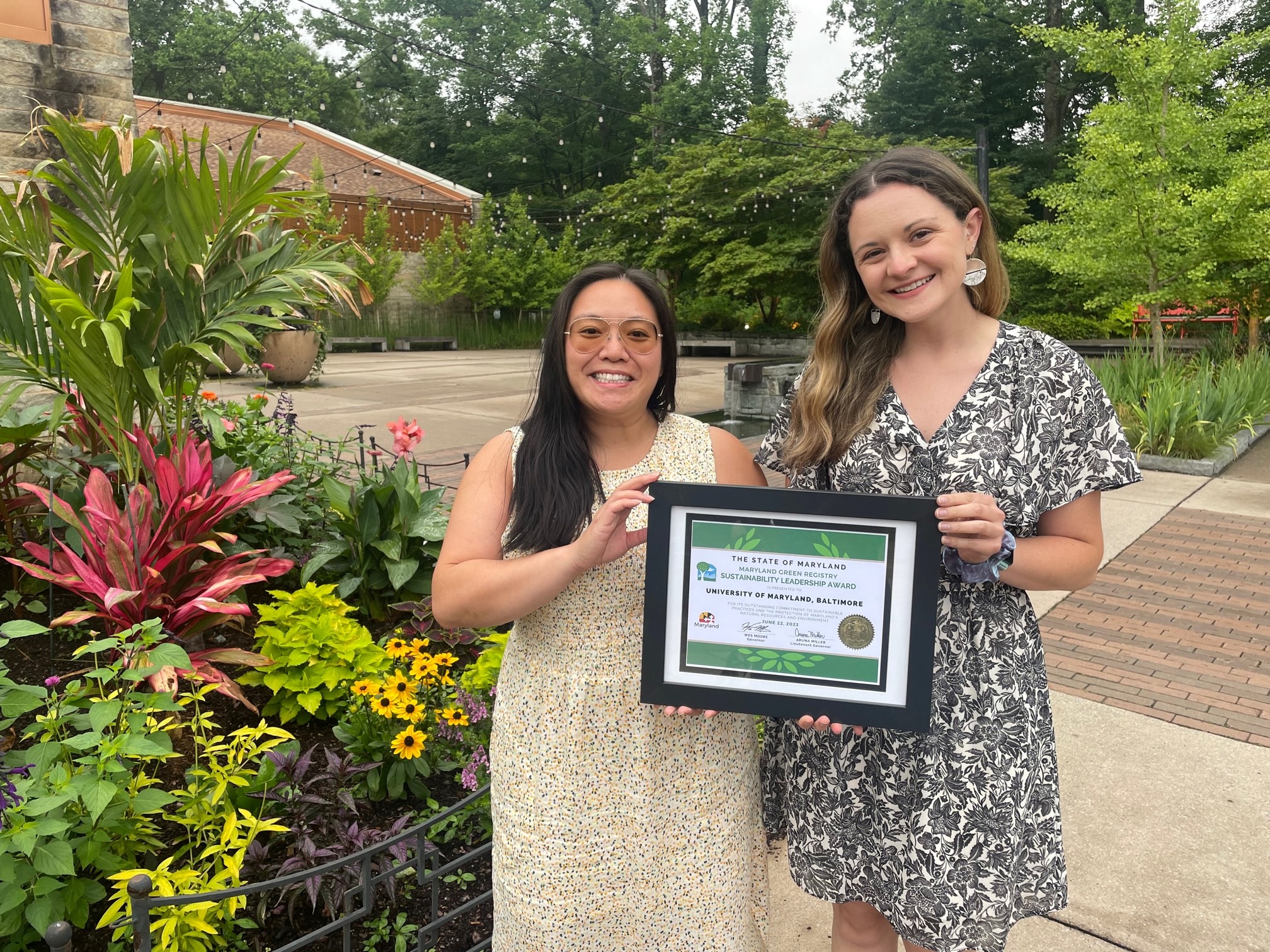 Sustainability team posing with Maryland Green Registry award